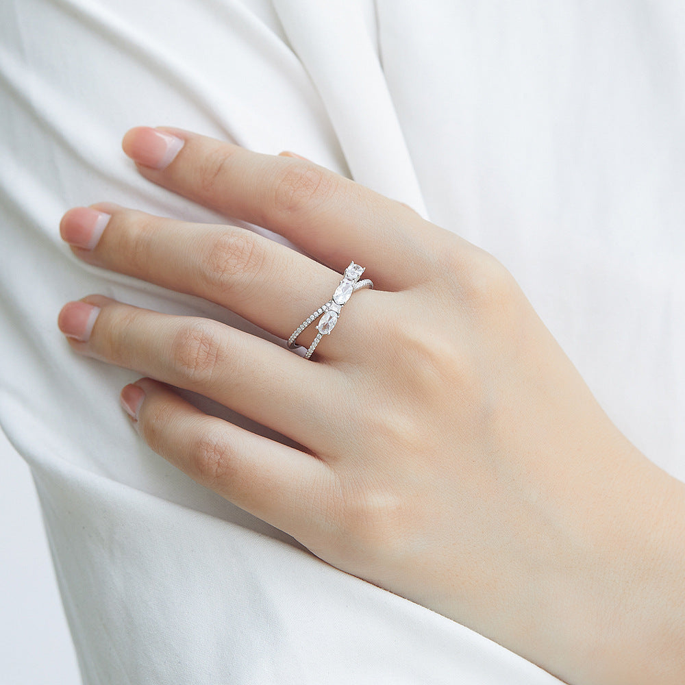 Rotating Cross Zircon Engagement Ring