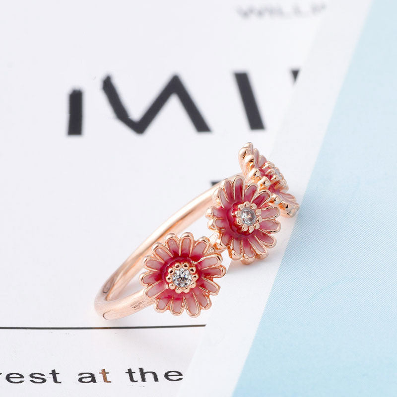 Three pink daisy rings