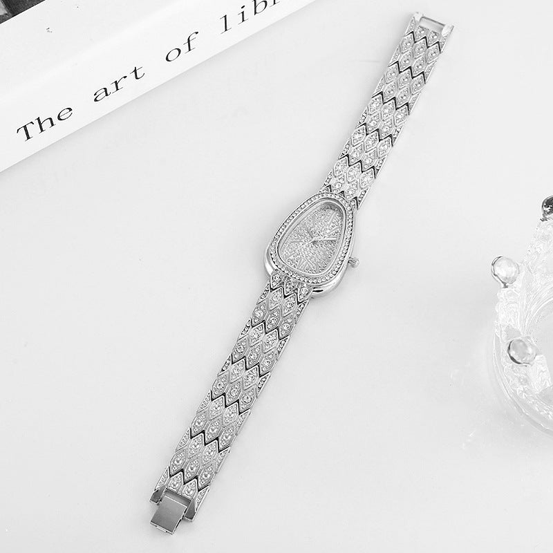 A Watch With A Steel Chain Is Studded With Flashing Diamonds